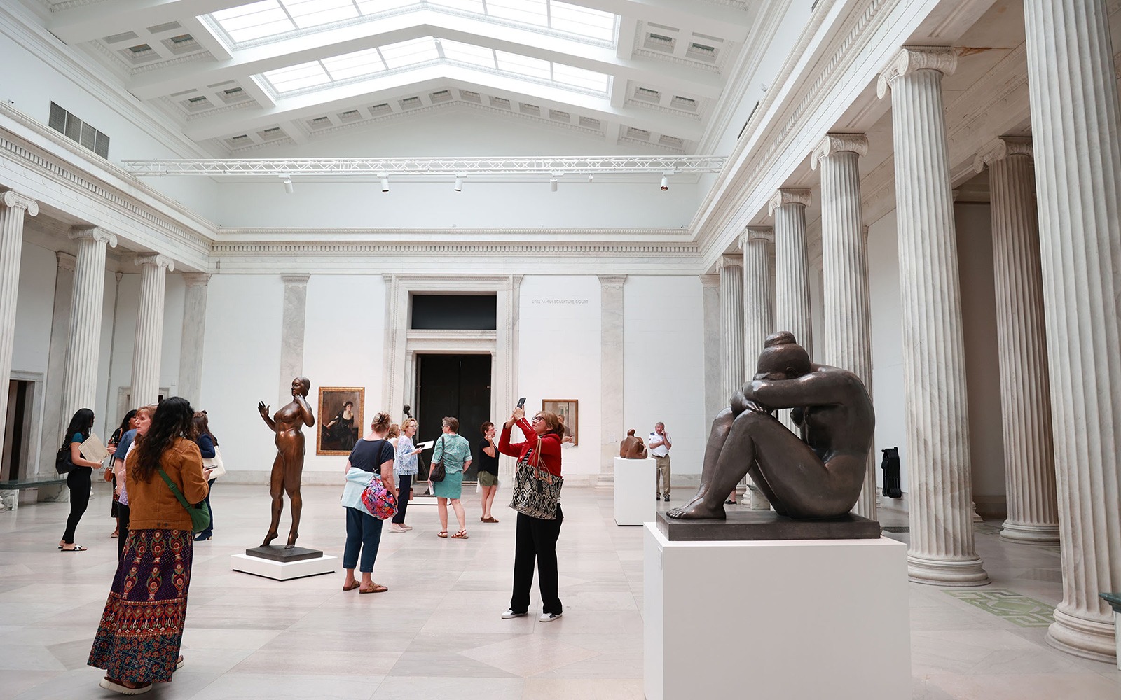 Visitors enjoy the Sculpture Court in the Wilmers Building at Buffalo AKG Art Museum which opens to the public after a $195 million renovation, Thursday, June 15, 2023. Formerly, the Albright-Knox Art Gallery had been closed since November of 2019 for the renovation. Photo by Sharon Cantillon.